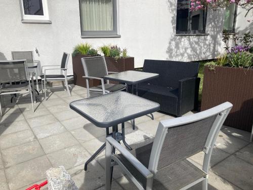 a group of tables and chairs on a patio at Brahms 25 in Regensburg