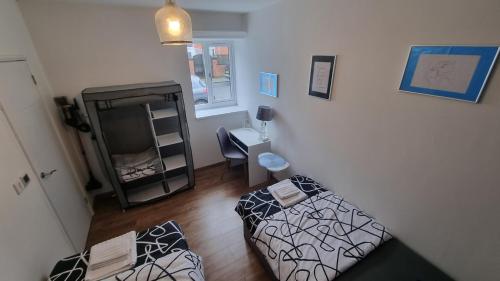 a living room with a couch and a television at Glamour no2 Flat in Mansfield