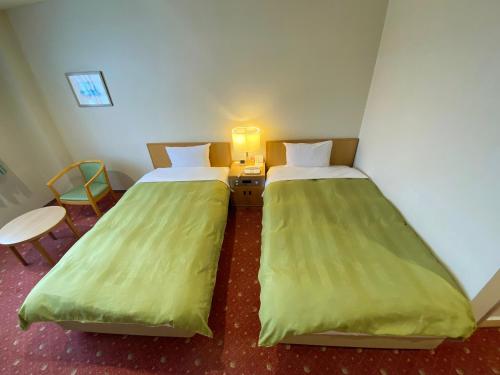 Una cama o camas en una habitación de Hotel Lavenir