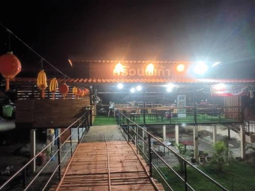 a train station at night with lights on at Noppakao Resort in Soem Ngam
