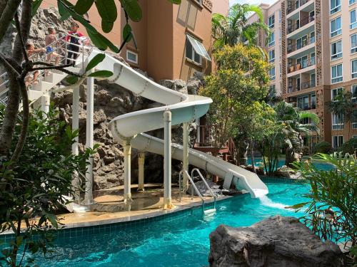 a slide in a pool at a resort at Atlantis Condominium Resort Pattaya in Jomtien Beach
