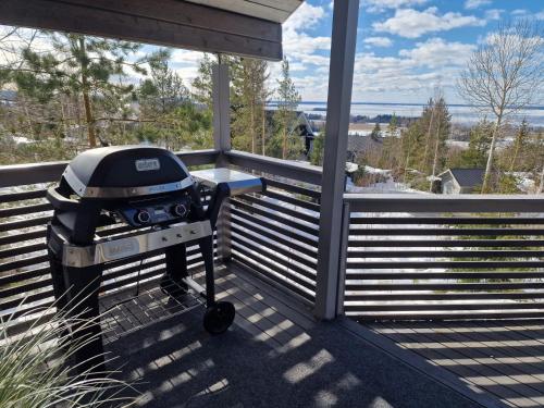 a grill on the front porch of a house at Villa Laiskajaakko in Vimpeli