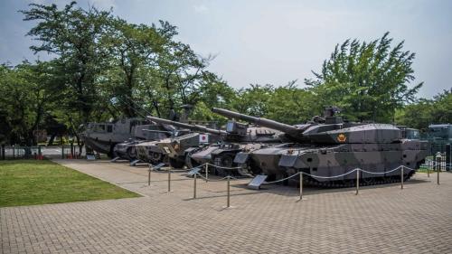 a row of tanks on display in a park at Toyoko Inn Wako-shi Ekimae in Wako