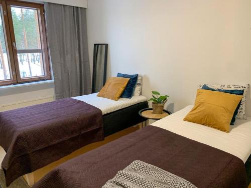 Ένα ή περισσότερα κρεβάτια σε δωμάτιο στο 2BR Apartment KA22, free parkig, sauna, big balcony