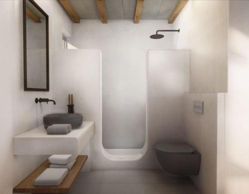 a bathroom with a sink and a shower and a toilet at Seascape, apartment with sea view 2 in Áno Meriá