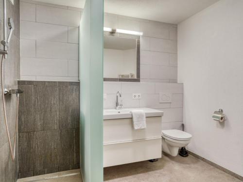 a bathroom with a sink and a toilet at Chalet in Neukirchen with Mountain Views in Rosenthal