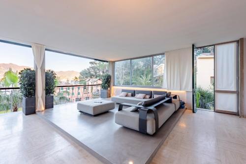 a living room with a couch and a table at Sea View Terrace In Santa Margherita - Happy Rentals in Santa Margherita Ligure