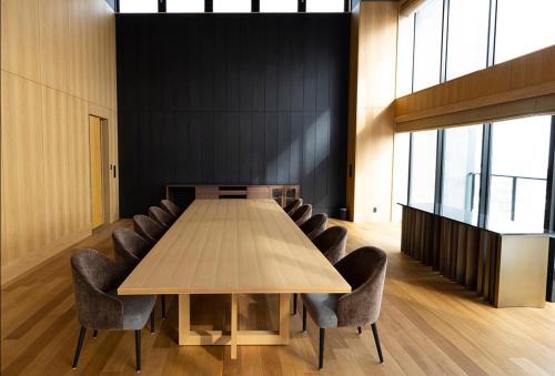 a conference room with a wooden table and chairs at ANA InterContinental Appi Kogen Resort by IHG in Hachimantai