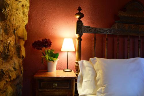 Posteľ alebo postele v izbe v ubytovaní Les Velles Escoles