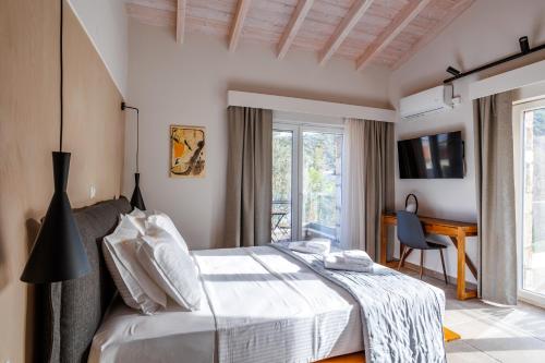 Ένα ή περισσότερα κρεβάτια σε δωμάτιο στο Petritis Villas
