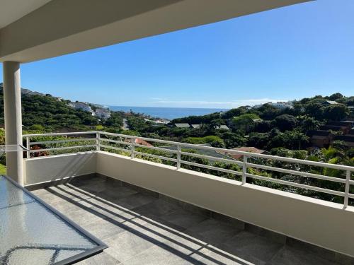a balcony of a house with a view of the ocean at 22 Lands End in Ballito