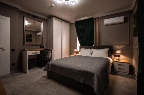 En eller flere senge i et værelse på Sobor Family Resort