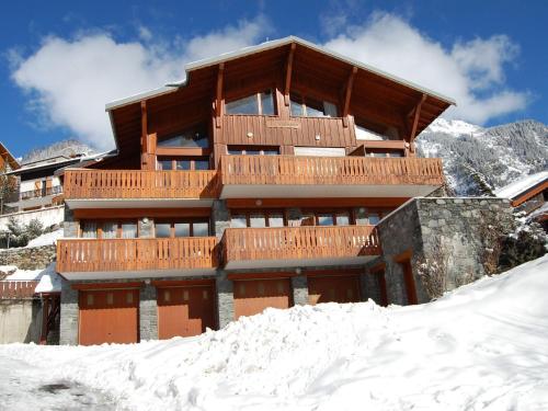 a building with snow in front of it at 4 6 pers holiday appartment near center of Champagny in Le Villard
