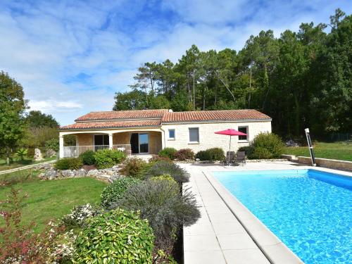een huis met een zwembad in een tuin bij Holiday home in Montcl ra with sunny garden playground equipment and private pool in Montcléra