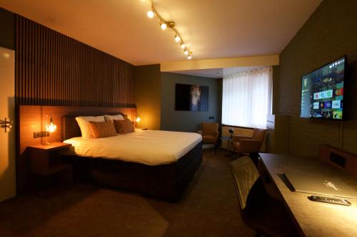Letto o letti in una camera di Hotel Arrows