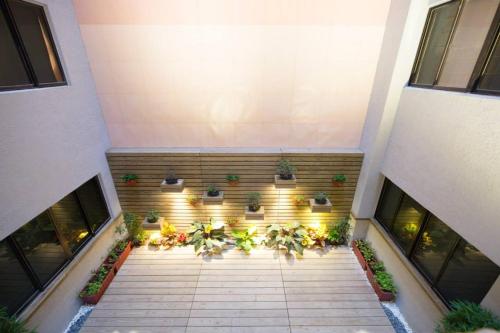 an overhead view of a building with potted plants at MILORD BOUTIQUE HOTEL in Kaohsiung