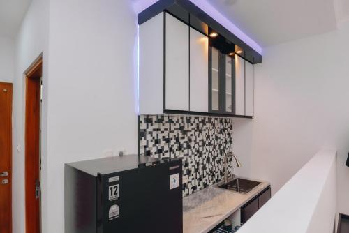 a bathroom with a sink and a mirror at Padma Amita Yogyakarta in Jetis