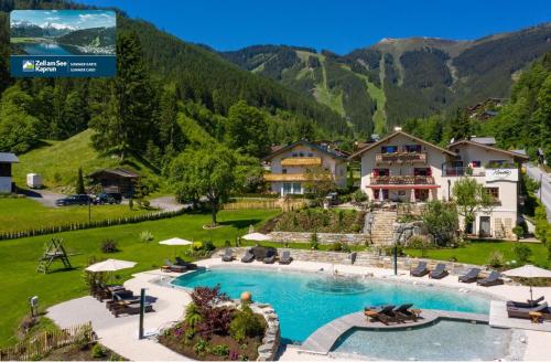 an aerial view of a resort with a swimming pool at Chalet "Villa Marlene" in Zell am See