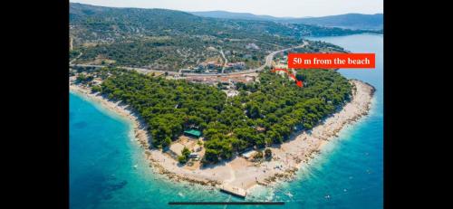 an island in the ocean with a red mark on it at Mobilehome Adams Glamping - Camp Adriatic in Primošten