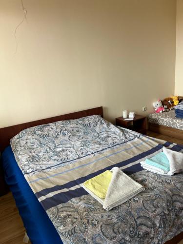 a bed with two pillows on it in a bedroom at Apartment with Sea View in Varna City
