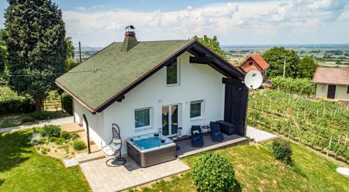an overhead view of a small white house with a hot tub at LA MIA STORIA in Beretinec