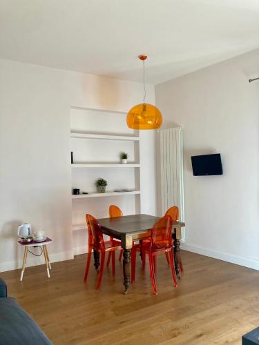 a dining room with a table and chairs at Agrigento Flat - apartment with Private Parking in Agrigento
