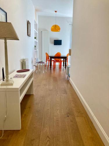 a living room with a table and a dining room at Agrigento Flat - apartment with Private Parking in Agrigento