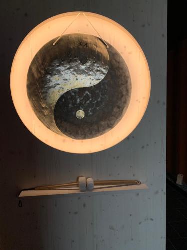 a large wooden bowl on top of a shelf at Alpenhotel Sonneck - mit Bergbahnticket in Bad Hindelang