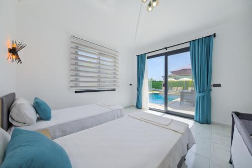 A bed or beds in a room at villa emir 2