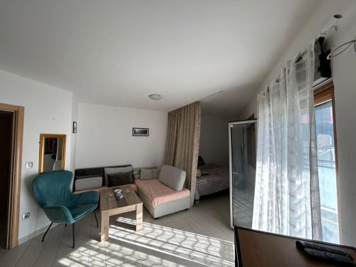 a living room with a couch and a table at Apartment Nadja in Budva