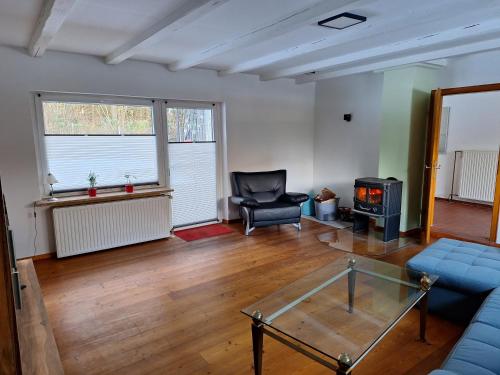 a living room with a couch and a chair at Nebenan in Soltau