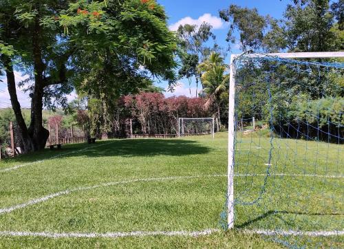 a soccer goal in the middle of a field at Pousada Nova Gironda in Paty do Alferes