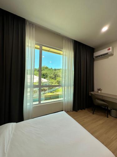 Postel nebo postele na pokoji v ubytování Wendu Inn Hotel