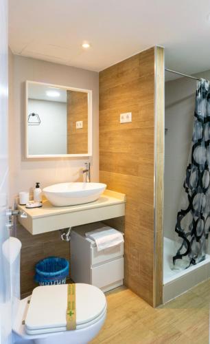 a bathroom with a sink and a toilet at Mijas Sea Views Apartment in Mijas Costa
