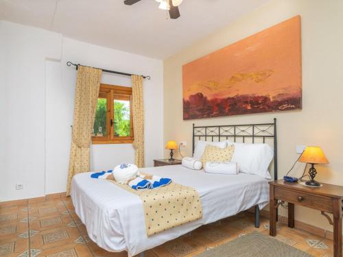 a bedroom with a large white bed and a window at Ca Sa Nina - Villa With Private Pool In Inca Free Wifi in Biniamar