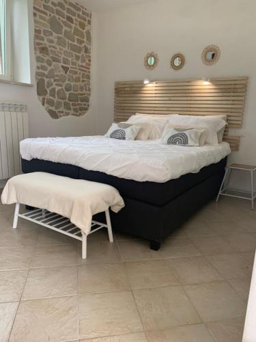 a large bed in a room with two mattresses at Boutique B&B Dolce Far Niente in Penne