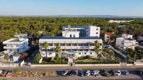 an aerial view of a large white building at Ticho's Greenblu Hotel in Castellaneta Marina