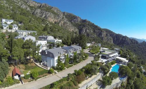 an aerial view of a resort in a mountain at Loryma Resort Hotel in Turunç