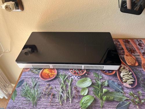 a laptop computer sitting on top of a table at Maison Du Soleil in Cima