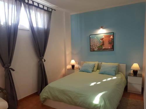 A bed or beds in a room at Apartments Playa La Aldea