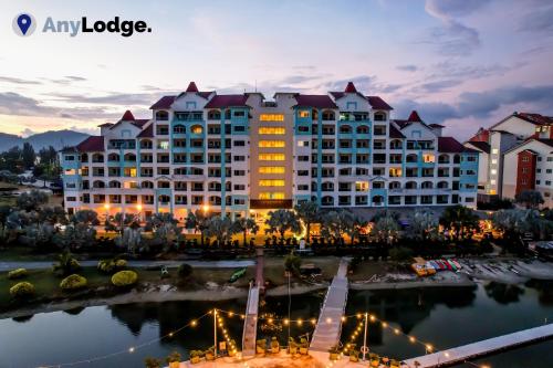 a large hotel with a lake in front of it at AnyLodge Waterfront Marina Island Pangkor in Lumut
