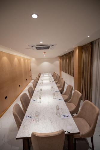 a large conference room with a long table and chairs at Nagarjun Resort - Embrace Tranquility Natures Retreat Beyond the City in Kathmandu