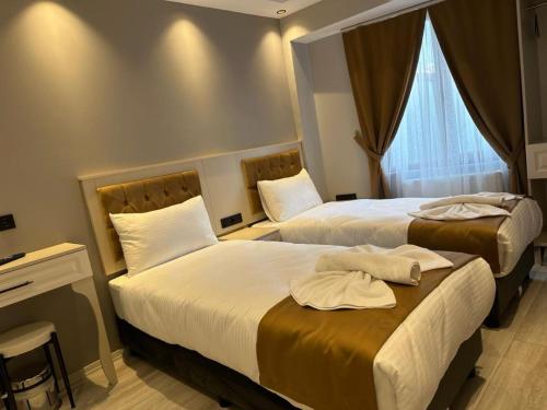 Postel nebo postele na pokoji v ubytování Sareban Hotel Istanbul