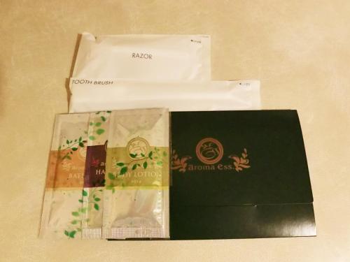 three envelopes sitting next to each other on a table at Green Hotel Kitakami in Kitakami