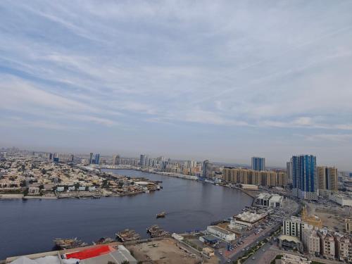 a view of a river in a city with buildings at Panorama Sea view Studio in Ajman 
