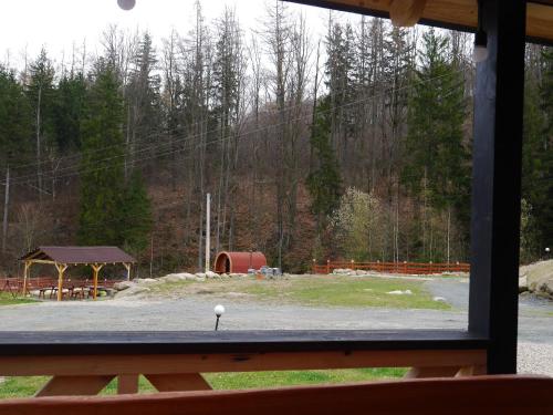 a view from a window of a park with a golf ball at Dziedziniec Karkonoszy in Podgórzyn