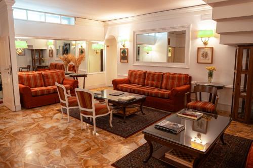 Uma área de estar em Hotel Modigliani