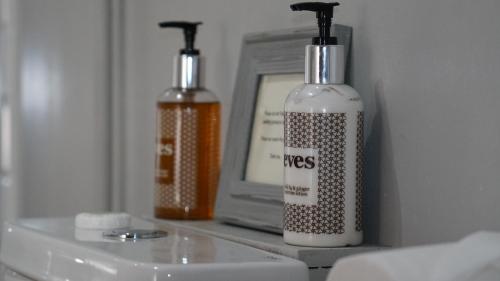 two bottles of cleaning products sitting on a counter at The Red Lion Eaton in Norwich