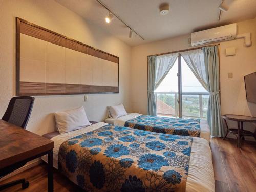Katil atau katil-katil dalam bilik di Yukurina Resort Okinawa