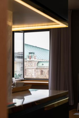 a view of a building from a window at The Guesthouse Vienna in Vienna